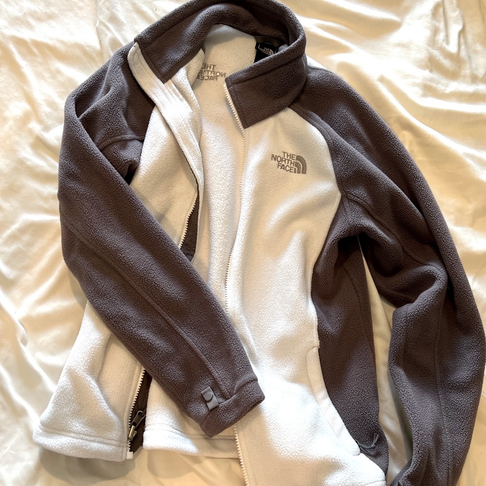 White and grey North Face zip-up jacket